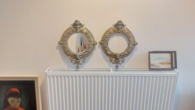 Stunning Pair of Antique Highly Detailed Rococo/Late Baroque Solid Cast Brass Round Mirror Frames with Cherubs Head, Satyr, Flowers and Foliage, One with Mirror and One Without Mirror, Circa 19th Century