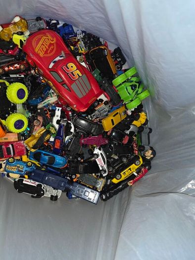 big bag of cars and a few wrestlers