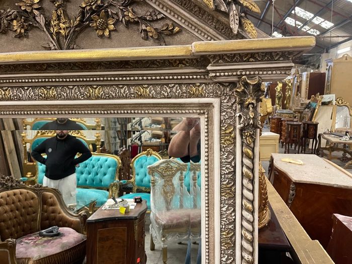 Very nice large mirror with light tones and architectural design