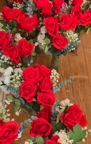 Red and white flowers in vases