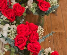 Red and white flowers in vases