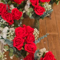 Red and white flowers in vases