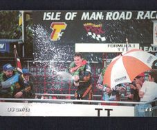 2001 Isle of Man 33 unit / GB3 Isle of Man TT Festival 2000 - Road Racing Capital of the World. Champagne flows for Ian Simpson after winning the Formula 1 race. ((Siemens - S30 (Module 34))) Phone Card