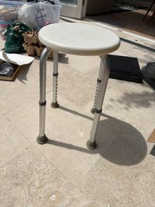Adjustable shower stool