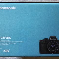 Panasonic Lumix G100D MFT mirrorless camera kit with 12-32mm lens, spare battery, and a Type-C travel charger