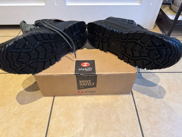 Steel toe safety boots.
