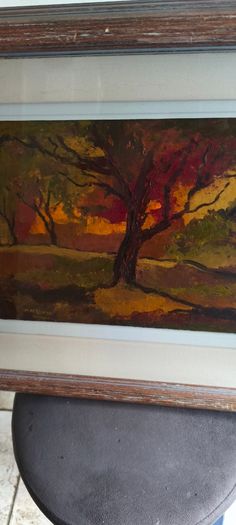 Framed under glass oil panting on board of land scape signed M.M KENNA