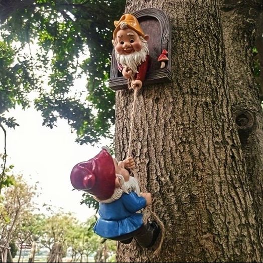 Gnome climbing statues for tree