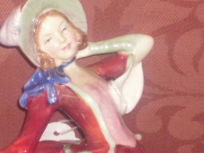 a royal doulton figure of a girl