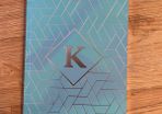 K notebook with lined pages