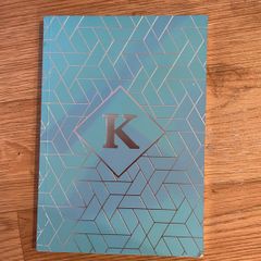 K notebook with lined pages
