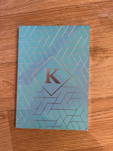K notebook with lined pages
