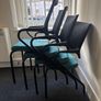Office chairs with black frames and teal seats Image 3