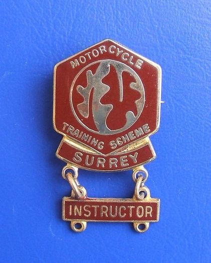 MOTORCYCLE TRAINING SCHEME (Surrey) - enamel badge with an INSTRUCTOR bar (c.1990's). Scarce with any added bar(s).