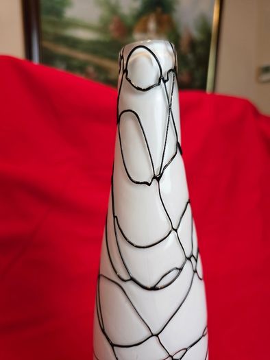 A decorative glass vase made of blown art glass, resembling a bottle in Murano style. Ornament