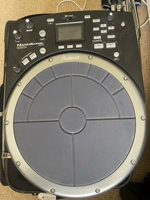 roland hand sonic with flight case