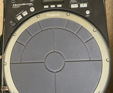roland hand sonic with flight case