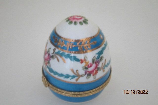 Beautifully painted ceramic egg trinket box
