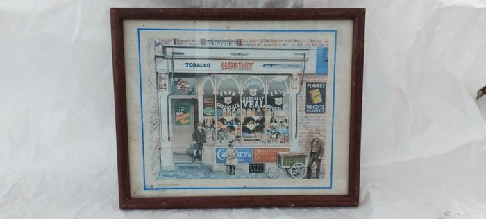 Old advertising shop front picture print ,different brands for sale, in the shop,nice for any home bar or man cave pub restaurant etc,,buyer collects thank you,, rather buyer collects with the glass ,sold as is ,,see pictures for condition