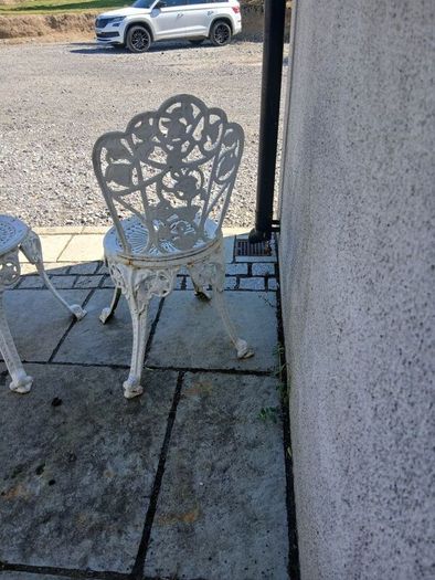 2 cast iron chairs