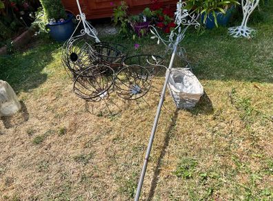 Seven Hanging Baskets and bird feeder. Well used.