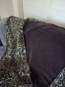 Large leopard skin fur throw and cushions