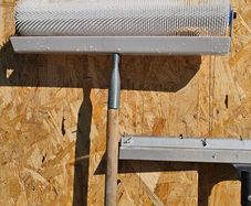 Levelling compound spiked roller and pin rake