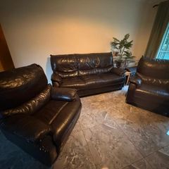 black leather sofa and arm chairs