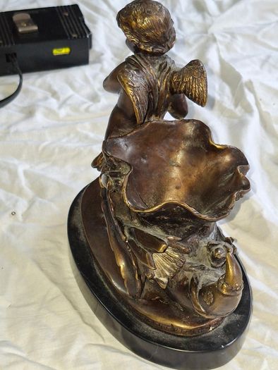 Bronzed Winged Cherub putto open seashell or leaf-shaped vessel with a scorpion like tail.