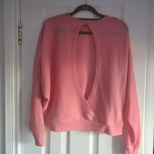 Pink long sleeve top cut back, size 10