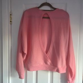 Pink long sleeve top cut back, size 10