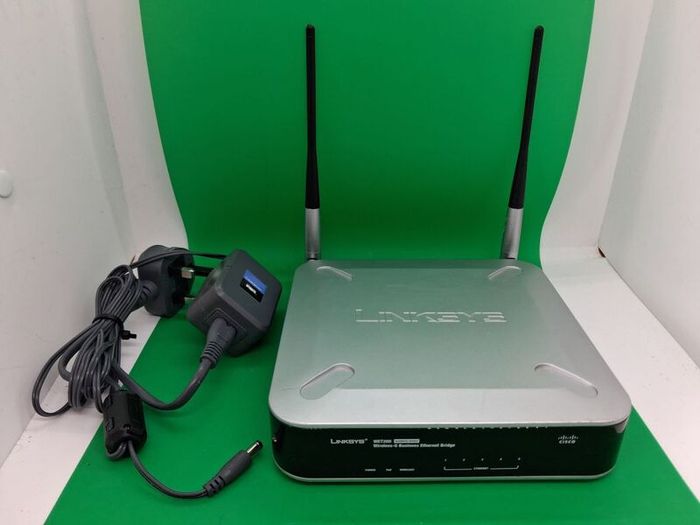 Postage - Linksys Cisco WET200 Wireless Ethernet Bridge Router.
