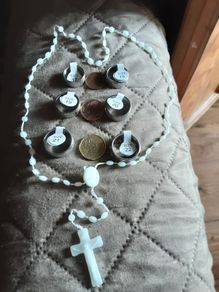 rosary beads and the lord's prayer ring