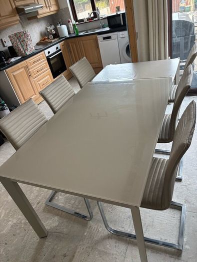 Extending dining table and chairs for sale