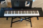 Yamaha Piaggero NP15 Portable Keyboard, Piano keys look, 61 Keys, USB connection, Black with Music stand and Heavy Duty keyboard Stand (Working Perfectly