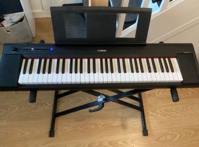 Yamaha Piaggero NP15 Portable Keyboard, Piano keys look, 61 Keys, USB connection, Black with Music stand and Heavy Duty keyboard Stand (Working Perfectly