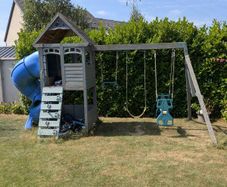 swing set with tub slide and climbing wall