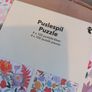 4 jigsaw puzzles on decorative box Image 3
