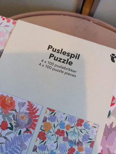 4 jigsaw puzzles on decorative box