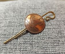 Vintage Irish Coin Brooch Pin Tie Slide attached to a brass crook design