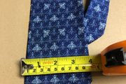Designer silk tie in blues with bee pattern