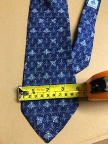 Designer silk tie in blues with bee pattern