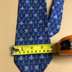 Designer silk tie in blues with bee pattern
