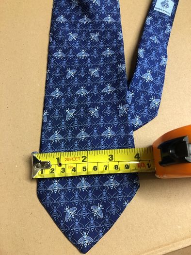 Designer silk tie in blues with bee pattern
