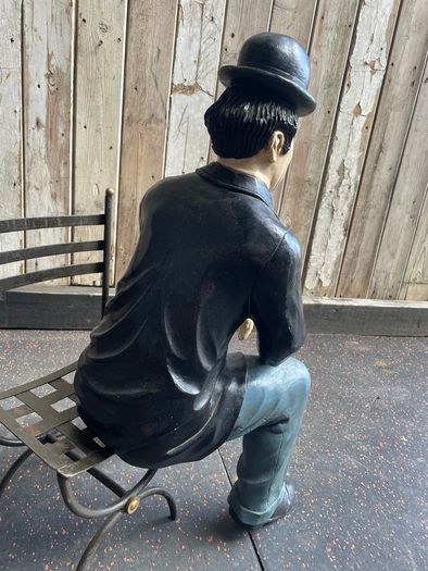 Charlie Chaplin resin sculpture figurine in metal chair