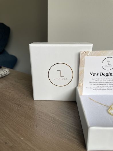 "Little Light". Gold crescent moon pendant.