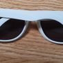A Pair of White Sun Glasses Image 3