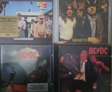 AC / DC.  Collection of 4 albums: Dirty Deeds Done Dirt Cheap / Highway To Hell / Let There To Be Rock / If You Want Blood.