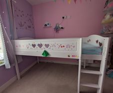 White wooden mid sleeper with pull out desk