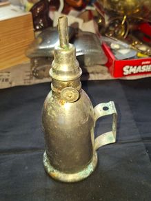 Antique French Lampe-Briquet lighter lamp manufactured by the brand TH. It is described as Sans Soudure The inscription Inexplosible indicates it was marketed as a safety product, often dating from before 1900s